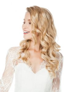 bride in wedding dress with hair styled